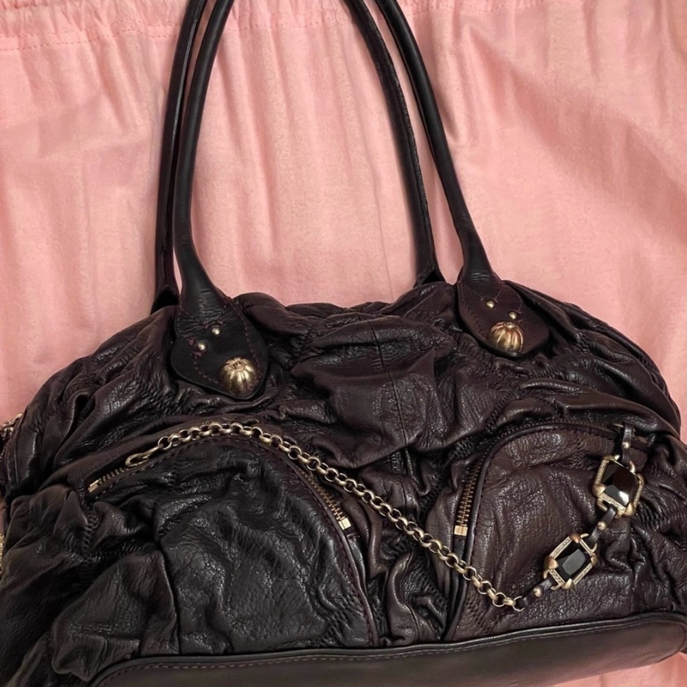 JUICY COUTURE LEATHER BAG .
